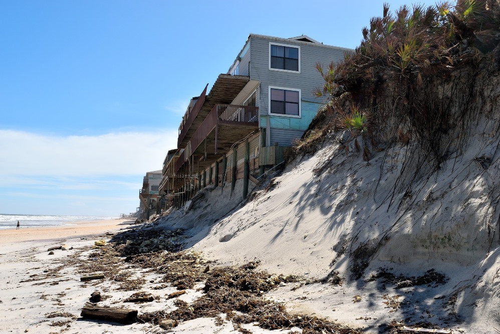 Beach erosion affecting houses