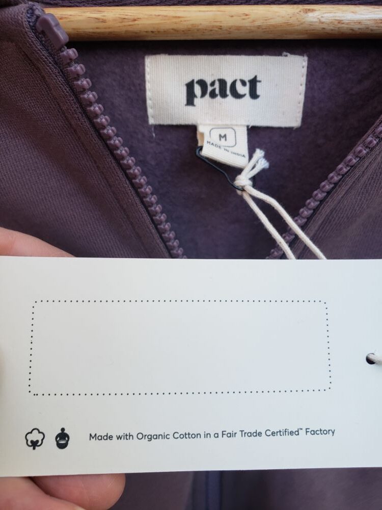 Tag on sweatshirt shows that it's made of 100% organic cotton, and made in a fair trade factory