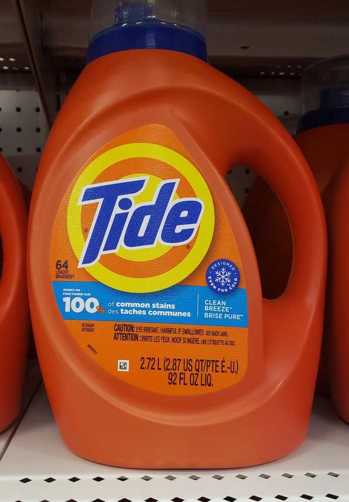 Big orange plastic jug of Tide liquid laundry detergent.